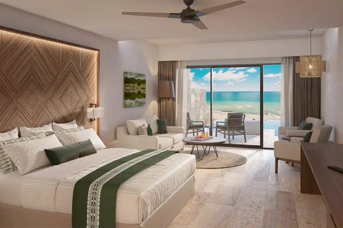 Single bed room with balcony overlooking the ocean.