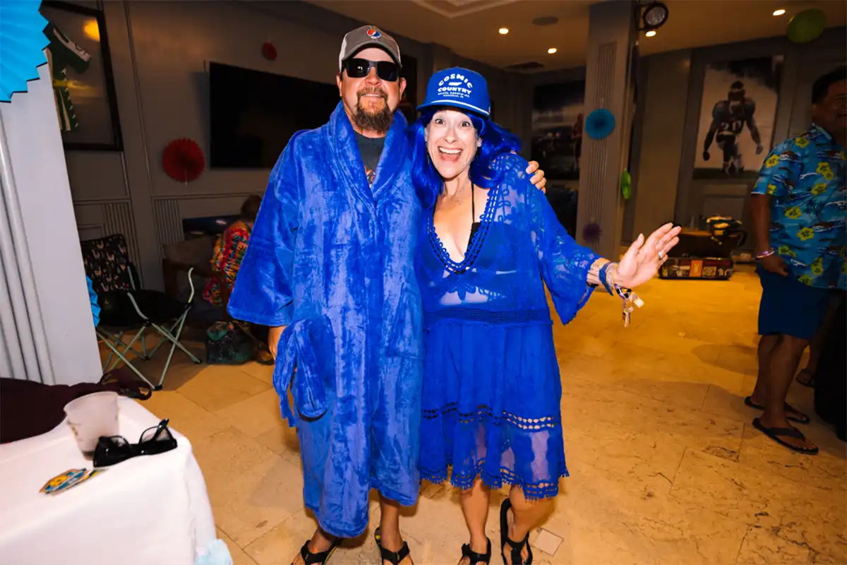 Guests wearing blue loyalty program robes posing together