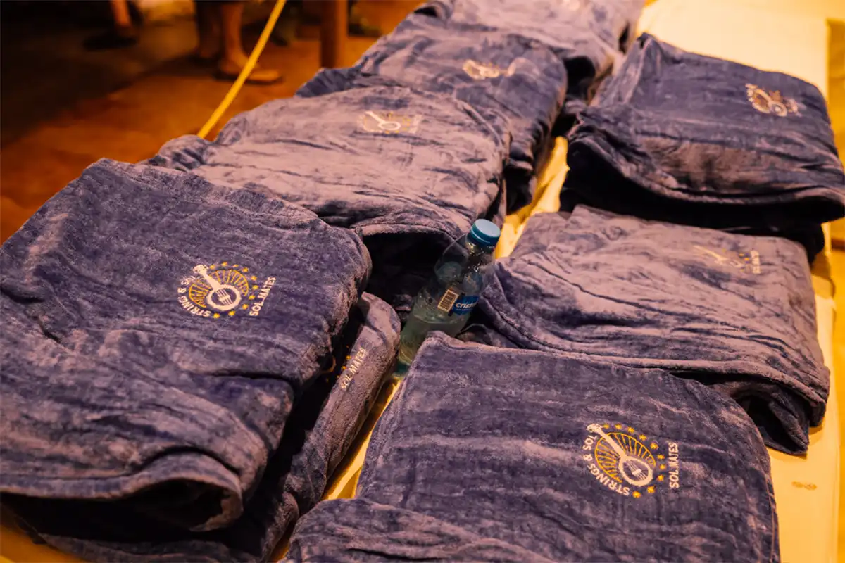 Close up photo of the blue loyalty program robes displaying the Sol Mate logo on them