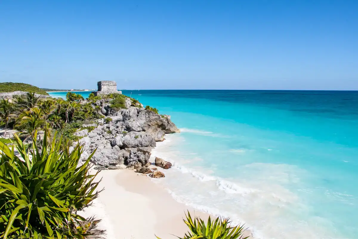 Coastal ruins overlooking ocean and sandy beach
