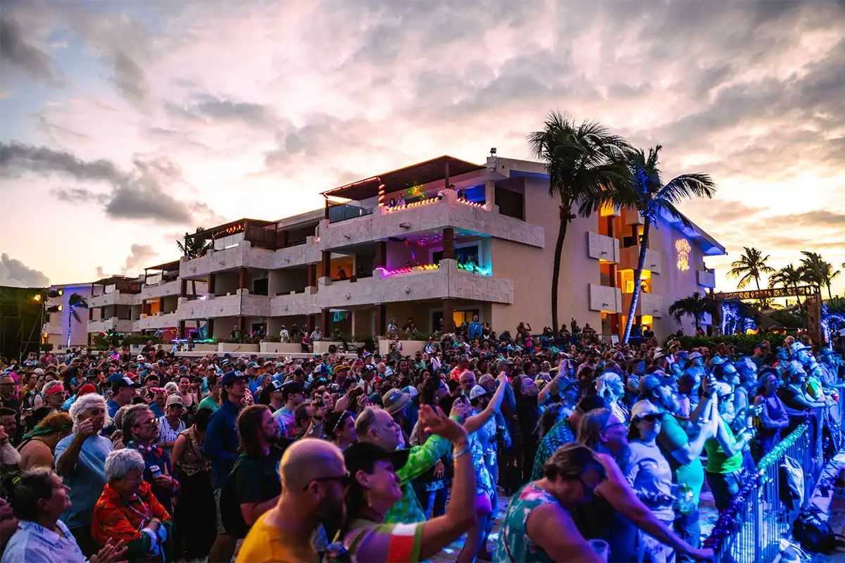 Oceanfront Suite rooms in the background of the Beach Stage crowd, displaying proximity to the conerts.