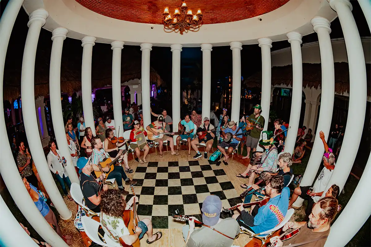 Guests playing instruments together during fan jam session