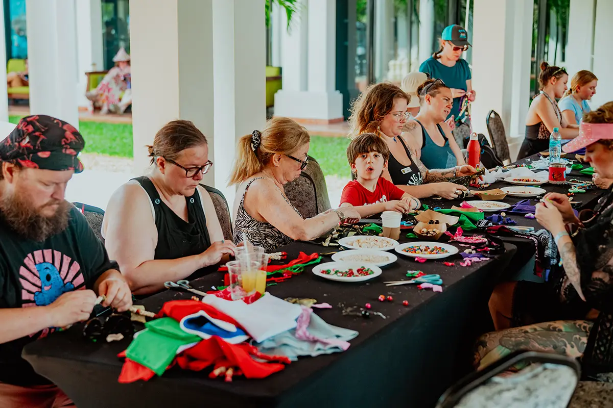 Table of guests participating in a crafting activity session.